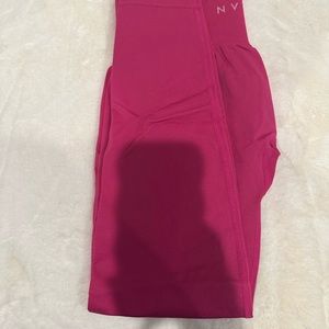MEDIUM HOT PINK Workout tights by NVGTN. NEVER worn. Good quality & pricey.